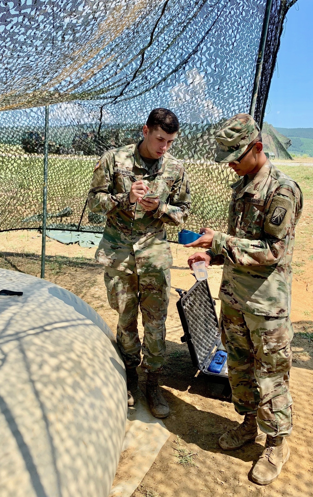 Soldiers test water before distributing to units during Strike Back 19