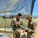 Soldiers test water before distributing to units during Strike Back 19