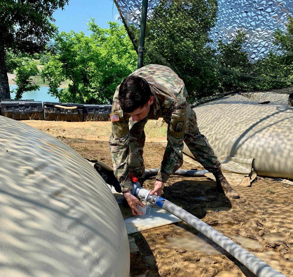 Soldier tests water quality during Strike Back 19