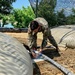 Soldier tests water quality during Strike Back 19