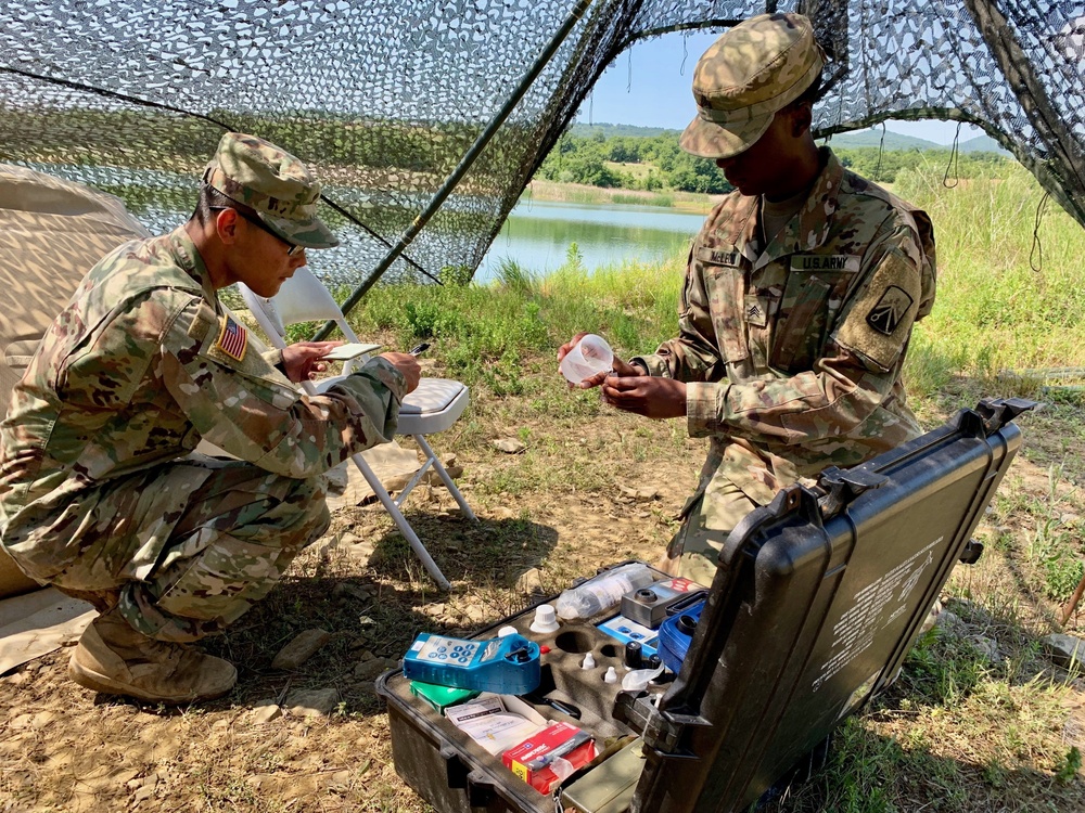 Soldiers test water before distributing to hundreds of Soldiers at Strike Back 19