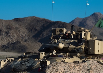 Army National Guard Infantrymen Seize a Town at NTC.