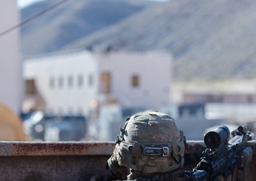 Army National Guard Infantrymen Seize a Town at NTC.