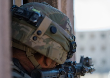 Army National Guard Infantrymen Seize a Town at NTC.