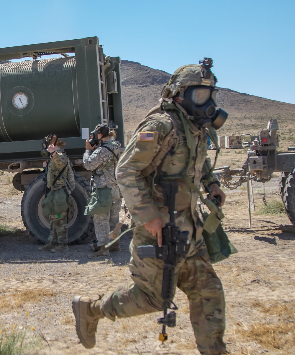 Idaho Army National Guard Soldiers from the 145th Brigade Support Battalion, 116th Cavalry Brigade Combat Team, don protective masks