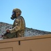 Idaho Army National Guard Soldiers from the 145th Brigade Support Battalion, 116th Cavalry Brigade Combat Team, don protective masks