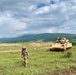 Soldier ground guides Bradley Fighting Vehicle during Strike Back 19