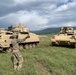 Soldier ground guides Bradley Fighting Vehicle during Strike Back 19