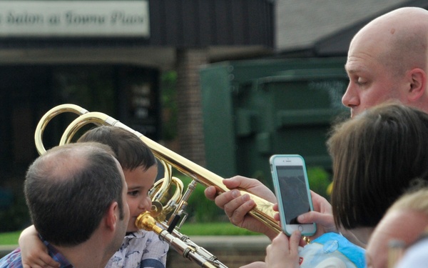 Little boy plays trombone