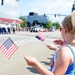 Kids waving flags