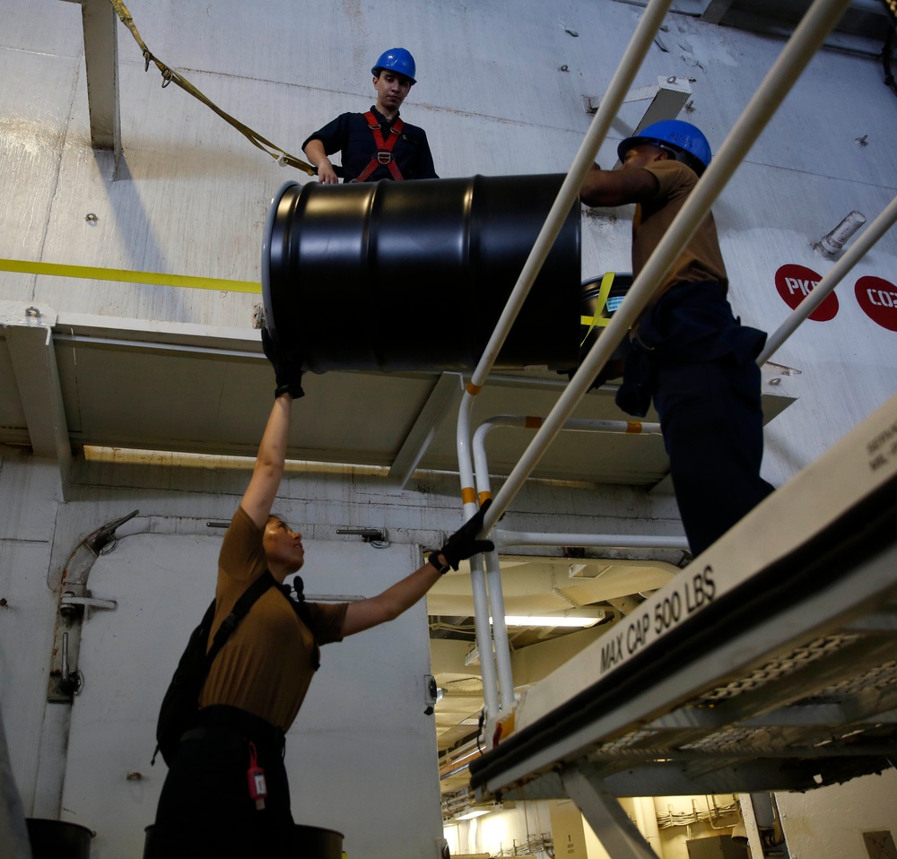 Sailors store barrels