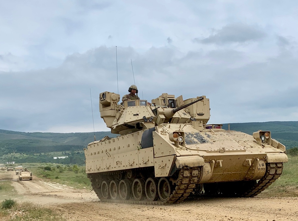 U.S. Army Bradley Fighting Vehicles travel to simulated tank battle during Strike Back 19