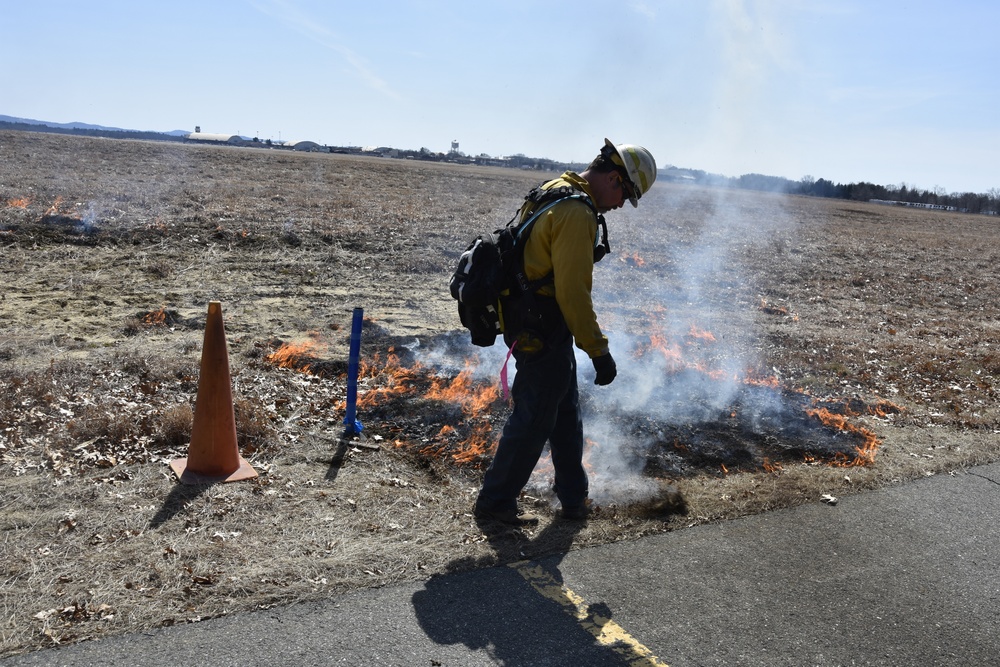 Westover personnel conduct controlled burn on airfield