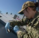 Nimitz Sailor Performs Maintenance On Jet Lockers