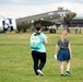 A Mother and Daughter Check Out a Display of Dakota DC3 Aircraft