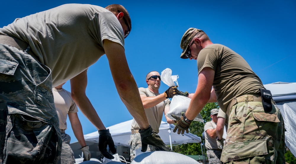 National Guardsmen fill sandbags to prepare for flooding