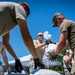 National Guardsmen fill sandbags to prepare for flooding