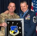 Col. David Manson presents the 152nd Airlift Wing High Roller mirror to Chief Master Sgt. Jesse Kimsey