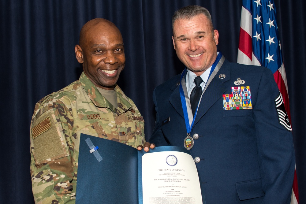 Brig. Gen. Ondra Berry presents Chief Master Sgt. Jesse Kimsey the Drennan A. Clark-Order of Nevada Medal