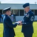 152nd Airlift Wing Commander, Col. Eric Wade presents the flag to retiring Chief Master Sgt. Jesse Kimsey