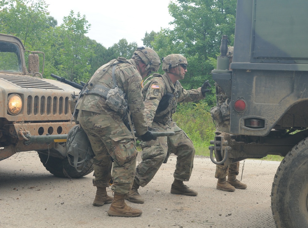 Oklahoma National Guard Soldiers perform vehicle recovery on a disabled HUMVEE at Fort Chaffee, Arkansas