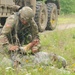 Oklahoma National Guards Soldier performs first aid at Fort Chaffee, Arkansas