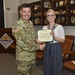 Col. William Glaser presents Commander’s Award for Public Service to Julia Lieberth