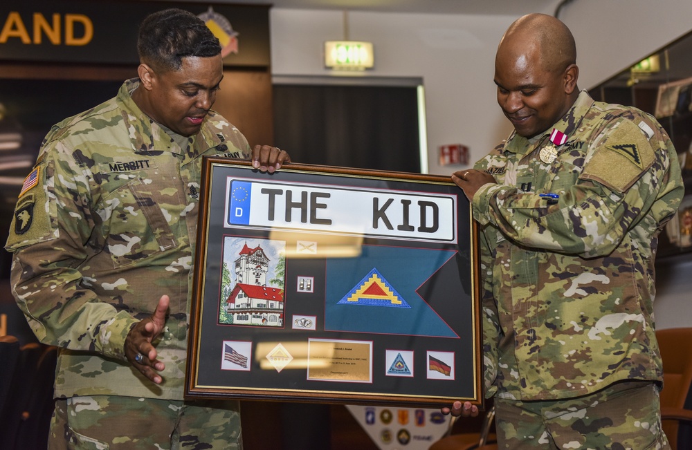 Sgt. Maj. Merritt presents a ‘going away’ plaque to Capt. Desmond Braziel