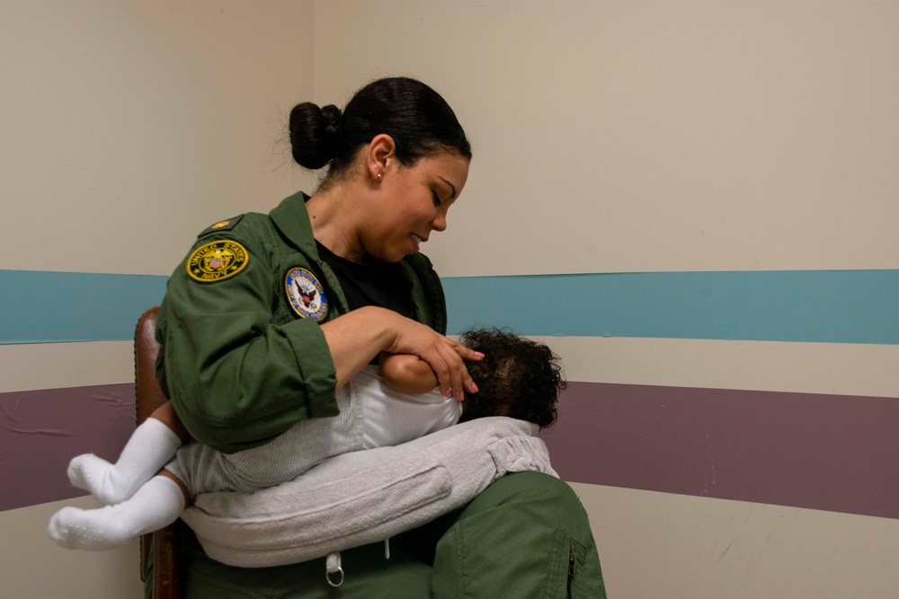A Sailor breastfeeds her child in the lactation room at Naval Support Facility Arlington, June 6, 2019.