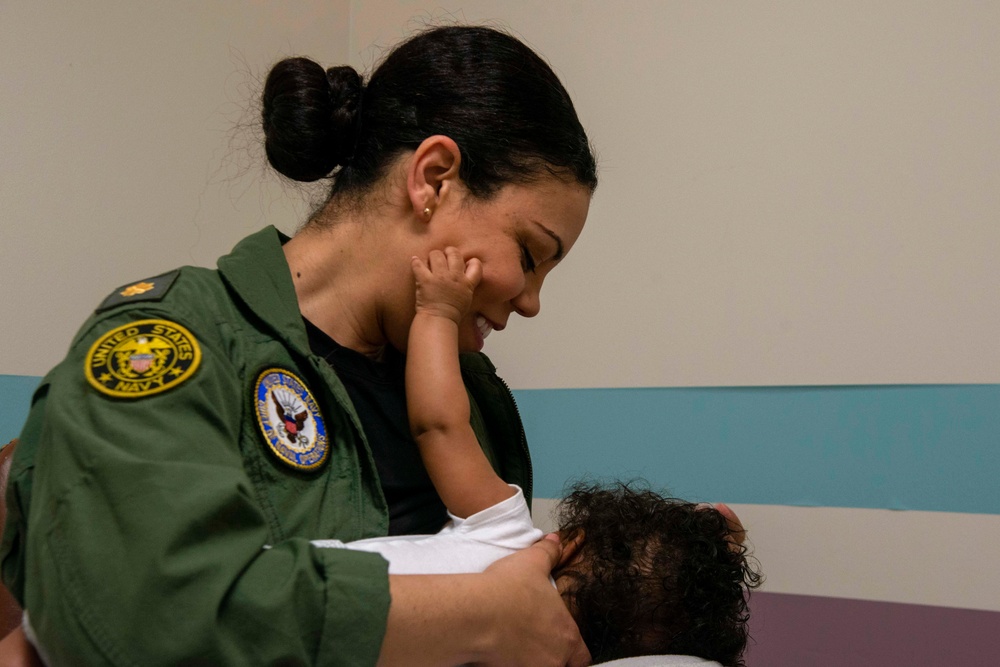A Sailor breastfeeds her child in the lactation room at Naval Support Facility Arlington, June 6, 2019