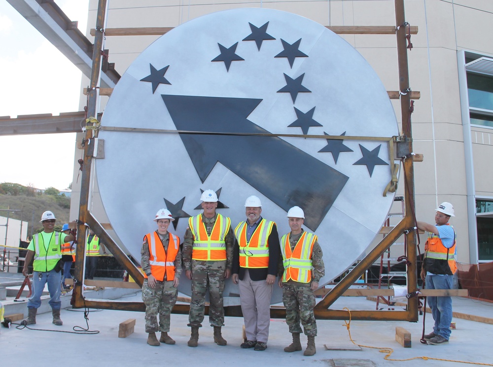 USARPAC Commander signs medallion prior to installation on new Mission Command Facility