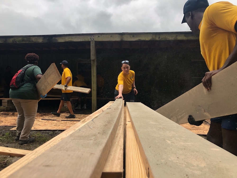 Sailors Stack Lumber