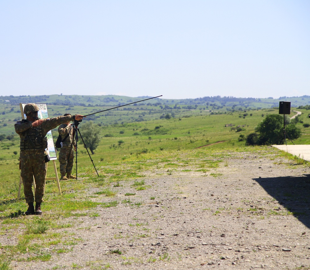 A Romanian Soldier displays where activities will take place during Media Day on Cincu Training Area, as part of Saber Guardian 19.