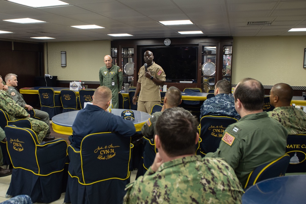 U.S. Navy Rear Adm. Roy Kelley and Force Master Chief Huben Phillips speak to Sailors