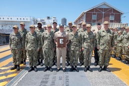 Vice Adm. Richard Brown presents the Battle "E" to USS Benfold (DDG 65)