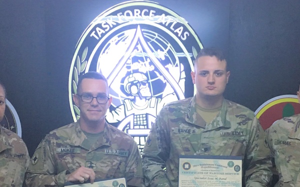Rand and McKee Receive Former Wartime Service Shoulder Insignia
