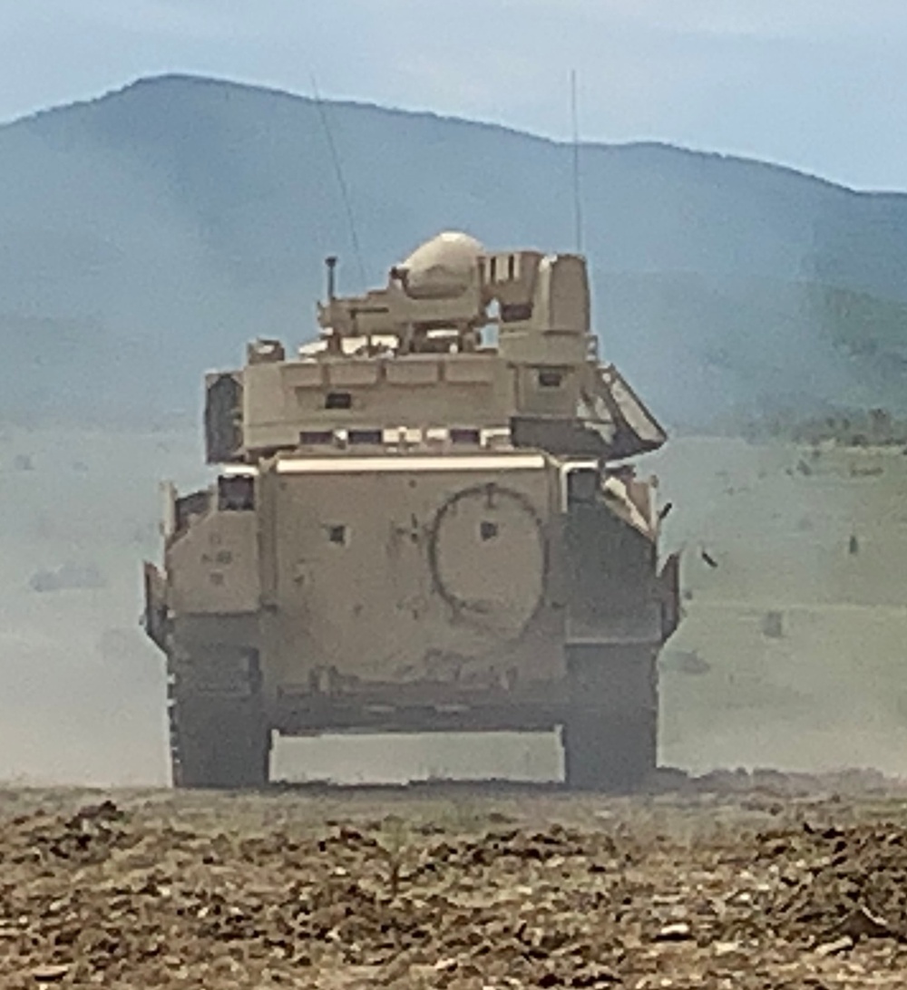 Shells fall from a Bradley Fighting Vehicle