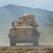 Shells fall from a Bradley Fighting Vehicle