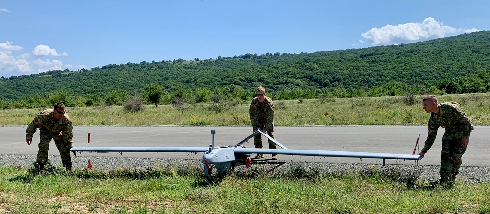 Soldiers prepares to load a RQ-to 7B V2 Shadow Unmanned Aircraft