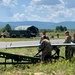 Soldiers loads a RQ-to 7B V2 Shadow Unmanned Aircraft to a high powered launcher