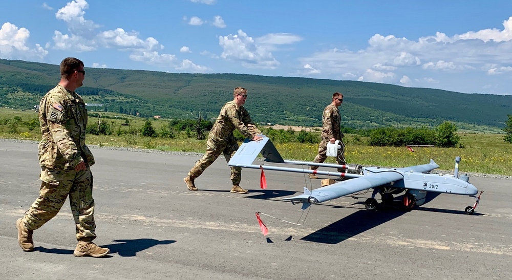 Soldiers push Shadow unmanned aircraft to high powered launcher