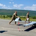 Soldiers push Shadow unmanned aircraft to high powered launcher