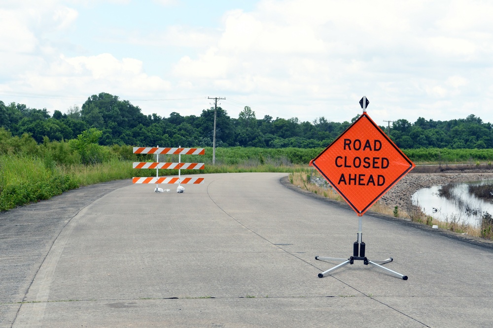 Signs Warn of Road Closures in Flooded Areas