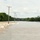 Flood Waters Cross Over a Roadway