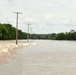 Flood Waters Cross Over a Roadway