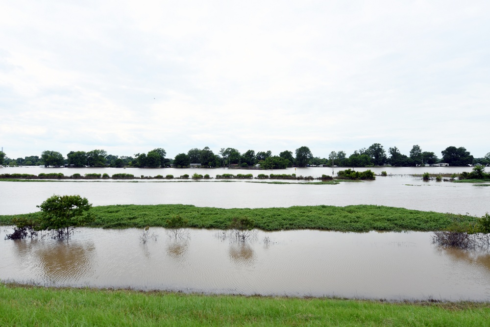 Neighborhoods Are Flooded by the Arkansas River