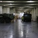 Soldiers and Marines load equipment aboard the U.S.N.S. Watkins (T-AKR 315) while moored at Wharf Alpha on Joint Base Charleston, South Carolina