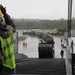 Soldiers and Marines load equipment aboard the U.S.N.S. Watkins (T-AKR 315) while moored at Wharf Alpha on Joint Base Charleston, South Carolina