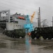 Soldiers and Marines load equipment aboard the U.S.N.S. Watkins (T-AKR 315) while moored at Wharf Alpha on Joint Base Charleston, South Carolina