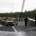 Soldiers and Marines load equipment aboard the U.S.N.S. Watkins (T-AKR 315) while moored at Wharf Alpha on Joint Base Charleston, South Carolina